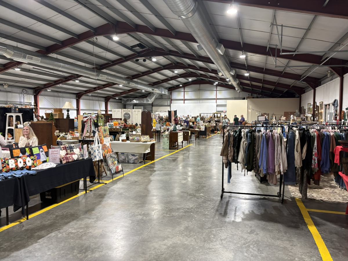 Vendor booths and clothing racks set up inside Jordan Hall at Finley Bee at the Fairgrounds, Bedford PA